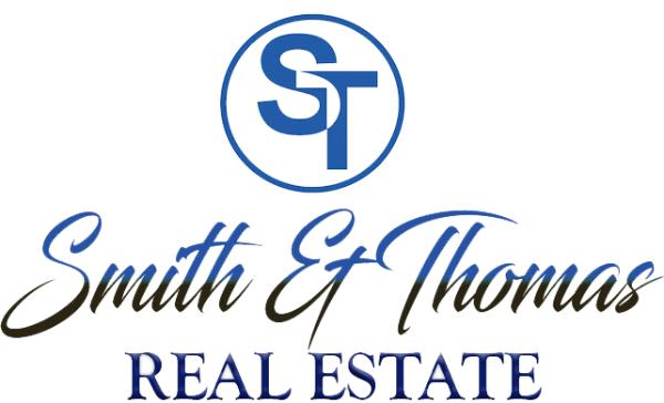 SMITH & THOMAS REAL ESTATE Logo