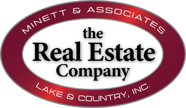 THE REAL ESTATE CO. LAKE & COUNTRY, INC Logo